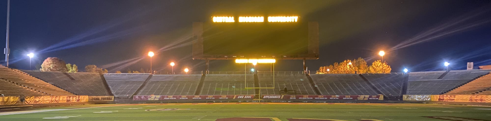 empty football stadium at night under the lights Omaha
